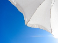 White umbrella and blue sky
