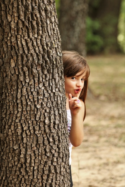 Girl Hiding Behind Tree 