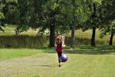 Little Girl Kicking Ball