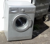 Oude kapotte wasmachine