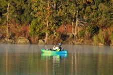 Fisherman in Kayak in Fall