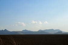 Arable Land And Distant Mountains