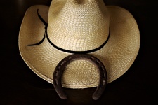 Cowboy Hat And Horseshoe On Black