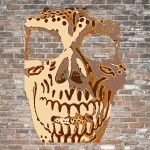 Skull head on brick wall