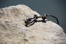 Boat anchor in a rock