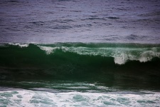 Deep green colour of cresting wave