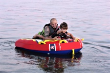 Father and Daughter Tubing on Lake