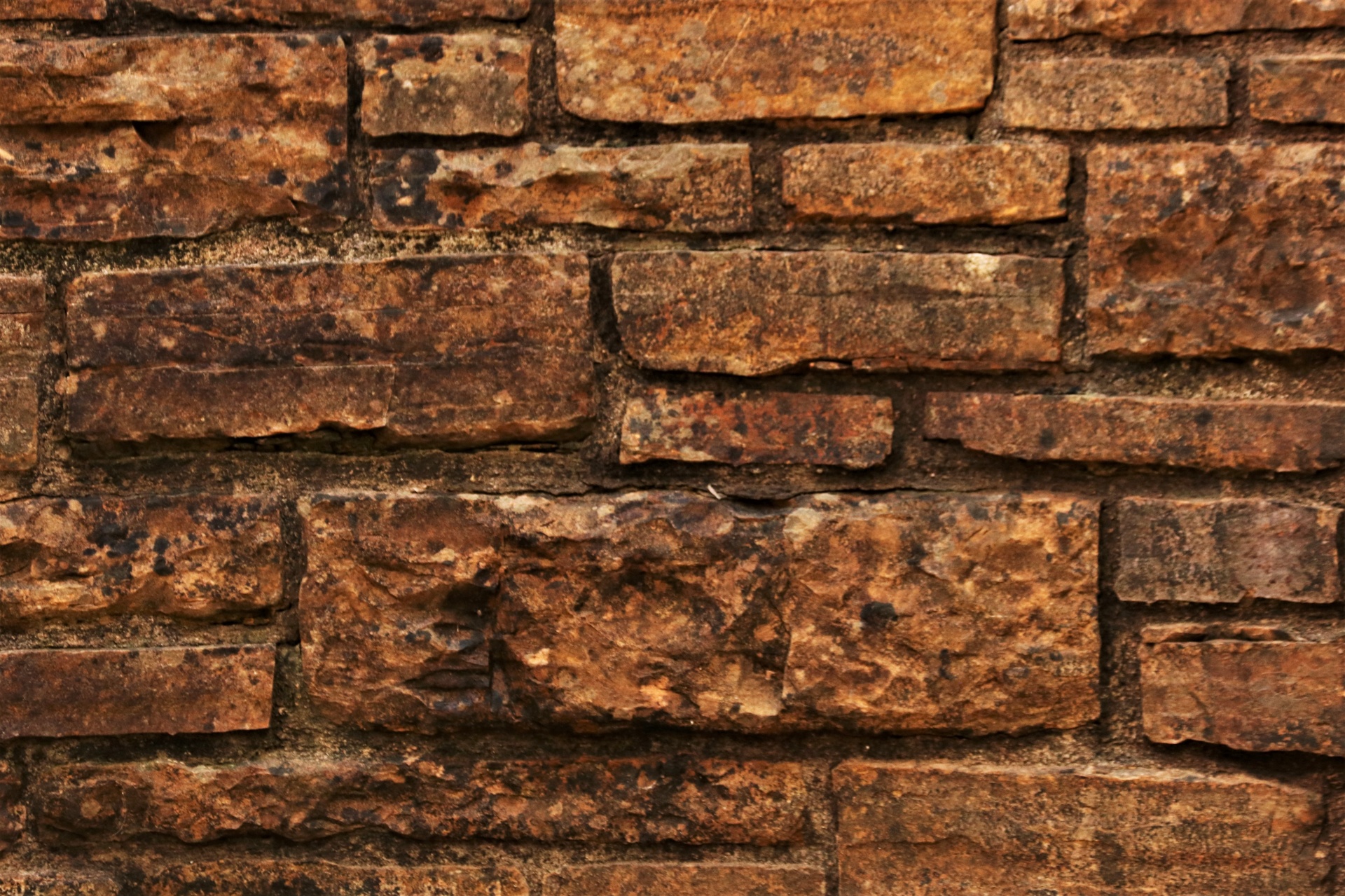 Fondo de pared de piedra marrón