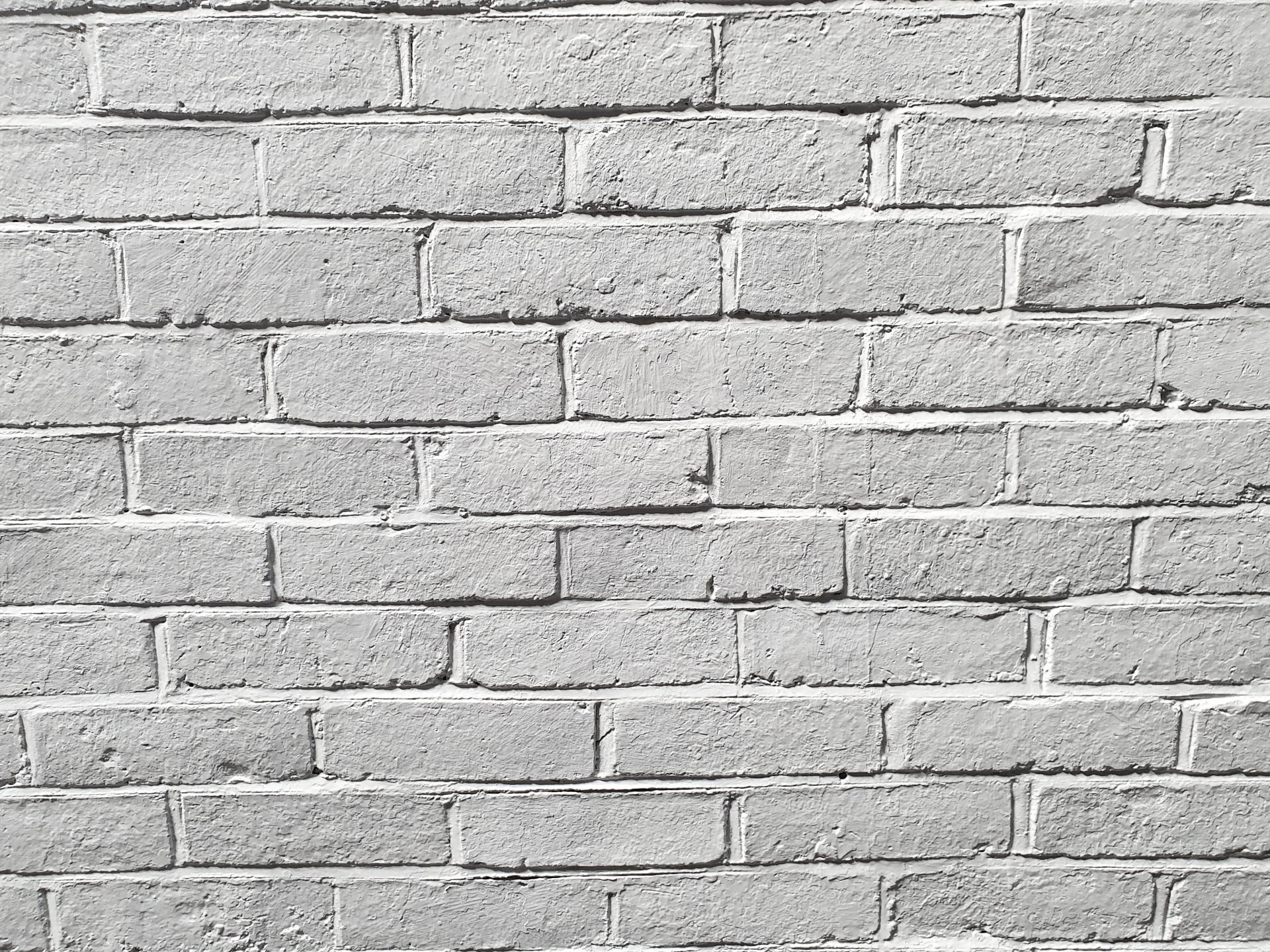 Bílá cihlová zeď