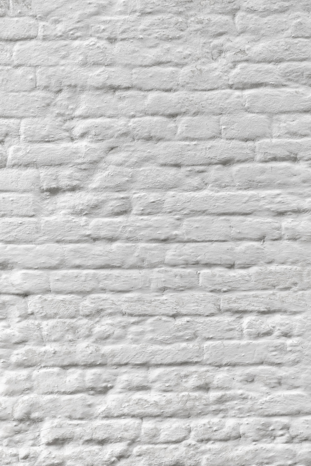 Muro di mattoni verniciato bianco