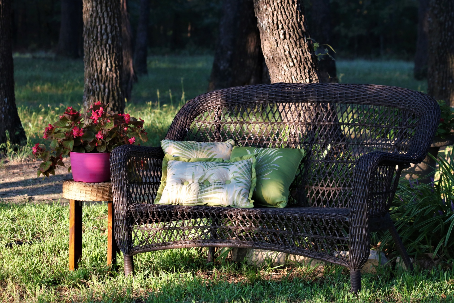 Wicker Chair And Flowers Outdoors