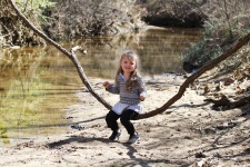Little Girl Playing At Creek