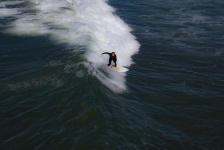 Surfer On Crest Of Wave