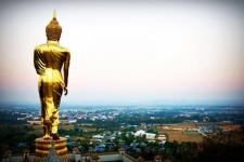 Golden Buddha statue on a mountain Wat