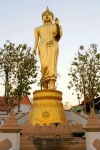 Golden Buddha statue on a mountain