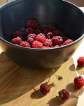 Sunny background with raspberries