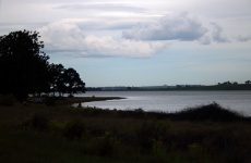 View Of Dam With Clouds In The Sky