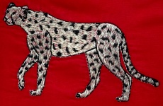 Broderad leopard på tyg