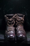 A Pair Of Old Combat Boots On Trunk