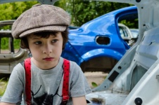 Boy and old cars