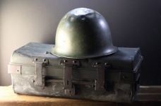 Combat Helmet On A Steel Trunk