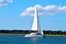 Sailboat cruising along the river