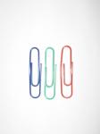 Big Paper Clips On White Background