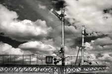 Railway signaling and cloudy sky