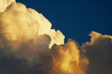Golden glow on white clouds