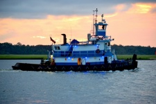 Tugboat cruising on the river