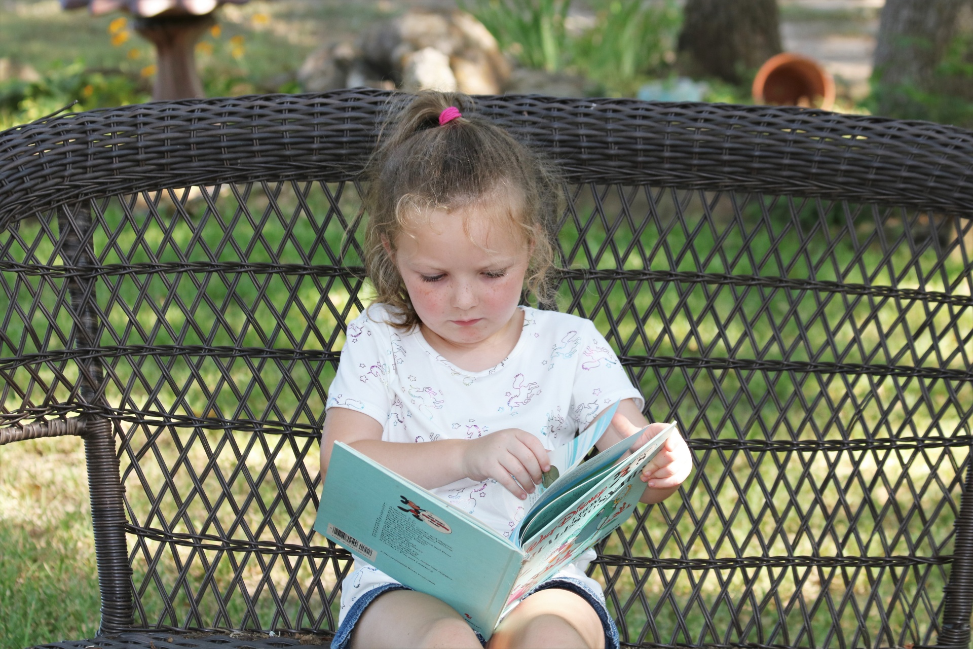 little-girl-reading-a-book-outside-free-stock-photo-public-domain