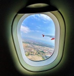 View from a plane window on takeoff