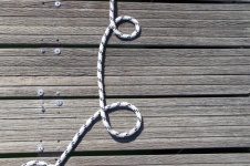 Coil Of Rope On Boardwalk Planks