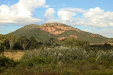 View of hill with sheer rock face