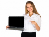 Woman Showing A Laptop Screen