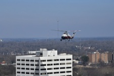 Helicopter Flying Over Building