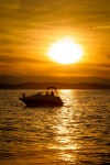 Speedboat at sunset