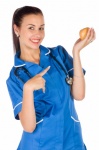 Nurse holding an apple