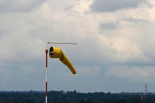 Yellow windsock on an aerodrome