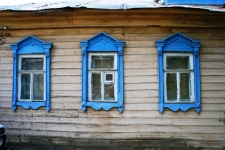 Three cut wooden frame windows