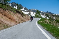 Mountain road, motorcyclist, alps, snow