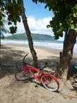 De bicicleta na praia