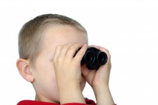 Child and binoculars
