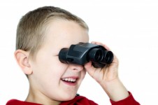 Child and binoculars