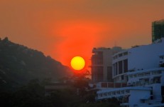 Sunset Over Hills And Hotels