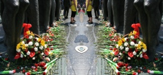 Flowers At The Foot Of Memorial