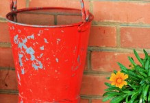Red fire bucket filled with water