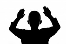 Silhouette boy with hands up